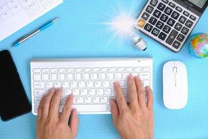 Businessman working on computer with idea innovation and inspiration concept photo