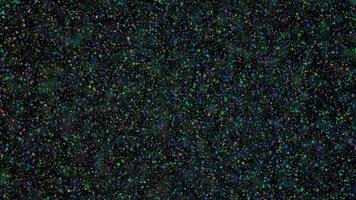 Abstract dark background with flying multicolored particles video