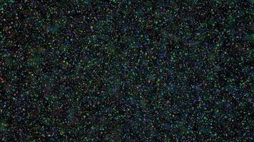 Abstract dark background with flying multicolored particles video