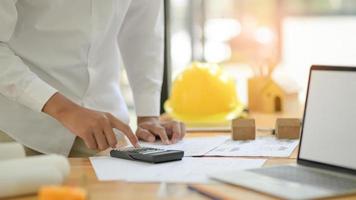 Architects are using calculators to design house plans for new projects. photo