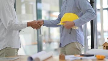 Engineers and architects join hands to work on the project to achieve its goals. photo