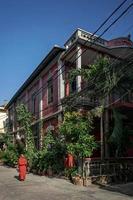 young buddhist monk walking in sunny phnom penh cambodia street photo