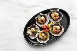 scallops in shell seafood tapas portion in barcelona restaurant spain photo