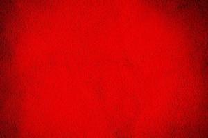 Natural red suede leather as a background. Wine colored velvet close up. photo