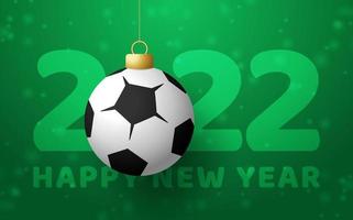 2022 Happy New Year. Sports greeting card with a soccer football ball on the luxury background with snowflake. Vector illustration.