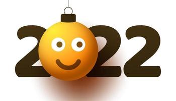 Tarjeta de felicitación para el año nuevo 2022 con una cara sonriente de emoji que cuelga de un hilo como un juguete, una pelota o una chuchería navideña. Ilustración de vector de concepto de emoción de año nuevo