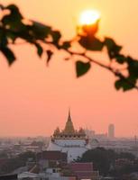 Landscape of The golden mount of Wat Saket at sunset photo