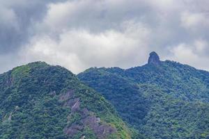 Abraao mountain Pico do Papagaio with clouds Ilha Grande Brazil. photo