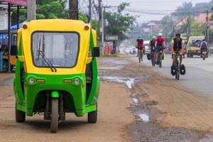 Luang Prabang, Laos 2018- Eco-friendly electronic tuk tuk rickshaw in Luang Prabang Laos photo