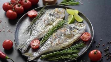 Delicious dorado baked on a grill with spices and herbs. Dorado cooked on about video