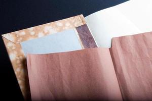 The process of book binding. Adding the brown endsheets photo