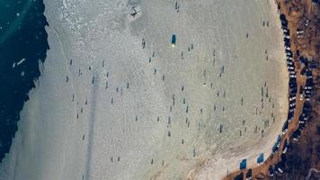 Aerial view of the ice surface with fishermen. photo