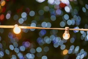 Yellow light bulbs on a blurry background with bokeh photo