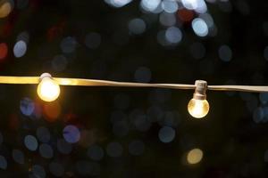 Yellow light bulbs on a blurry background with bokeh photo