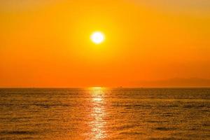 Bright orange sunset over the sea. photo