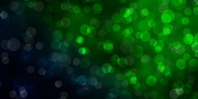 Dark Green vector background with circles.