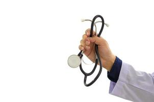 Doctor's hand holding patient stethoscope on white background. copy space photo