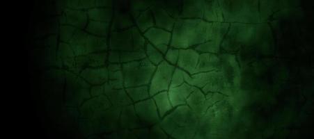 Scary dark green misty cracked wall for background photo