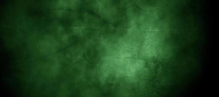 Scary dark green misty cracked wall for background photo