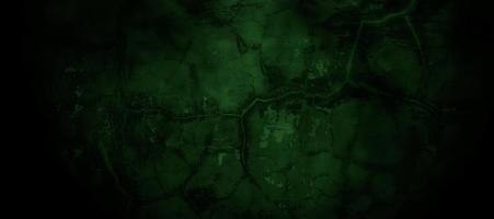 Scary dark green misty cracked wall for background photo