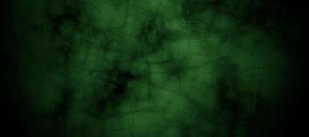 Scary dark green misty cracked wall for background photo