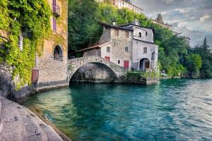 Old little village with a beautiful stone bridge along Lake Como