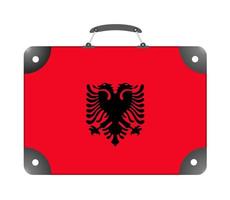 Bandera del país de Albania en forma de maleta para viajar sobre un fondo blanco. foto