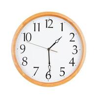 Round clock shows half past three photo
