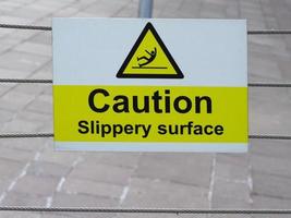 Caution slippery surface sign photo
