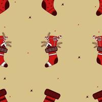 Navidad de patrones sin fisuras. calcetín navideño con regalos y bombones. ilustración vectorial. dibujado a mano vector