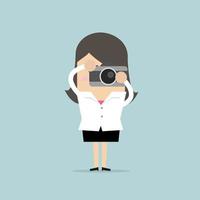Businesswoman takes a picture with camera. vector
