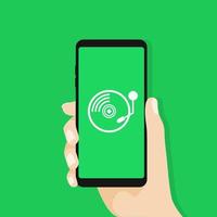 Hand holding smartphone with old record player icon. vector