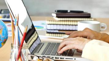 Business woman using laptop computer.