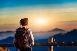 Woman watching the sunset photo