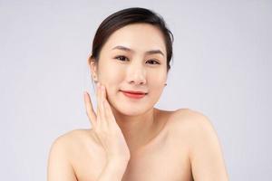 Beautiful young asian woman with clean fresh skin on white background, photo