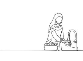 Single one line drawing of a woman in a hijab was washing the fruit in the sink from the germs that stick to it clean. Fruit put in a pretty basket. One line draw design graphic vector illustration.