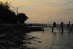 orange sunset on the beach photo