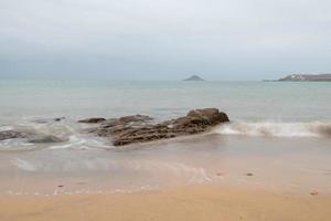 Cloudy morning, sea water, reefs and islands photo