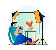 Photo studio concept in modern flat design. Woman photographer with photo camera works in professional salon with equipment, makes photoshoots, art and commercial photography. Vector illustration