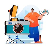 Photo studio concept in modern flat design. Man standing by huge photo camera works in professional with equipment. Photographer makes photoshoots, art and commercial photography. Vector illustration