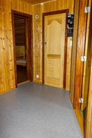 Cottage vacation interior decoration. Wooden hallway with doors in Norway photo