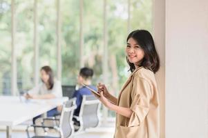 business woman using digital tablet in meeting room photo