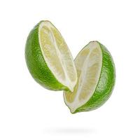 Two halves of lime isolated on white background.