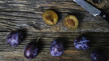 Italian plums on wooden background photo