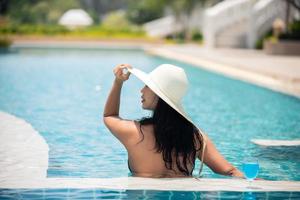 Women are swimming in a pool in summer. photo