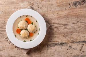 Traditional Jewish matzah ball soup photo