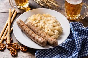 Bratwurst sausage ,sauerkraut, pretzels and beer photo