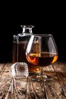 Cognac or whiskey drink on rustic photo