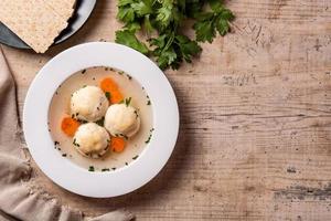 Traditional Jewish matzah ball soup photo