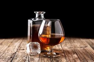 Cognac or whiskey drink on rustic photo